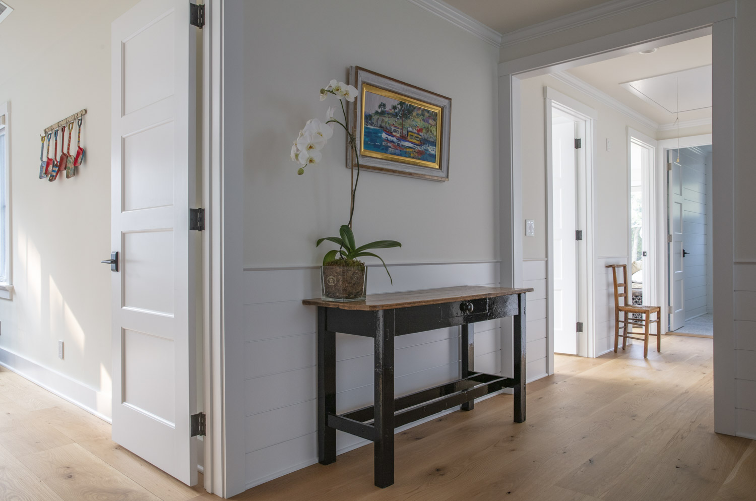 Water Hole blue door welcomes you. Build by Bruce Helier Builders.