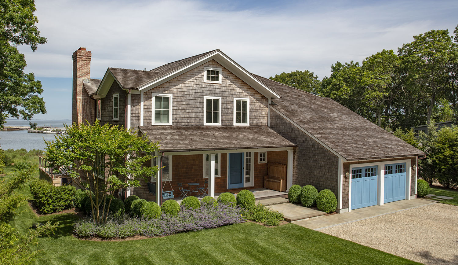 Water Hole blue door welcomes you. Build by Bruce Helier Builders.